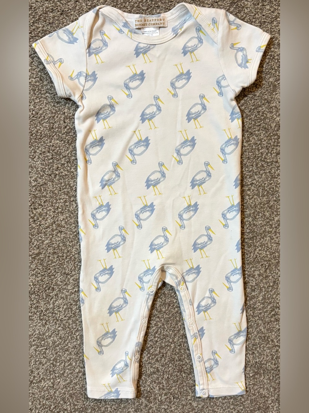 The Beaufort Bonnet Company White One-Piece with Blue and Yellow Pelican Print
